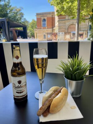 Bubbles, bier, and wurst on a table at the Festspielhaus